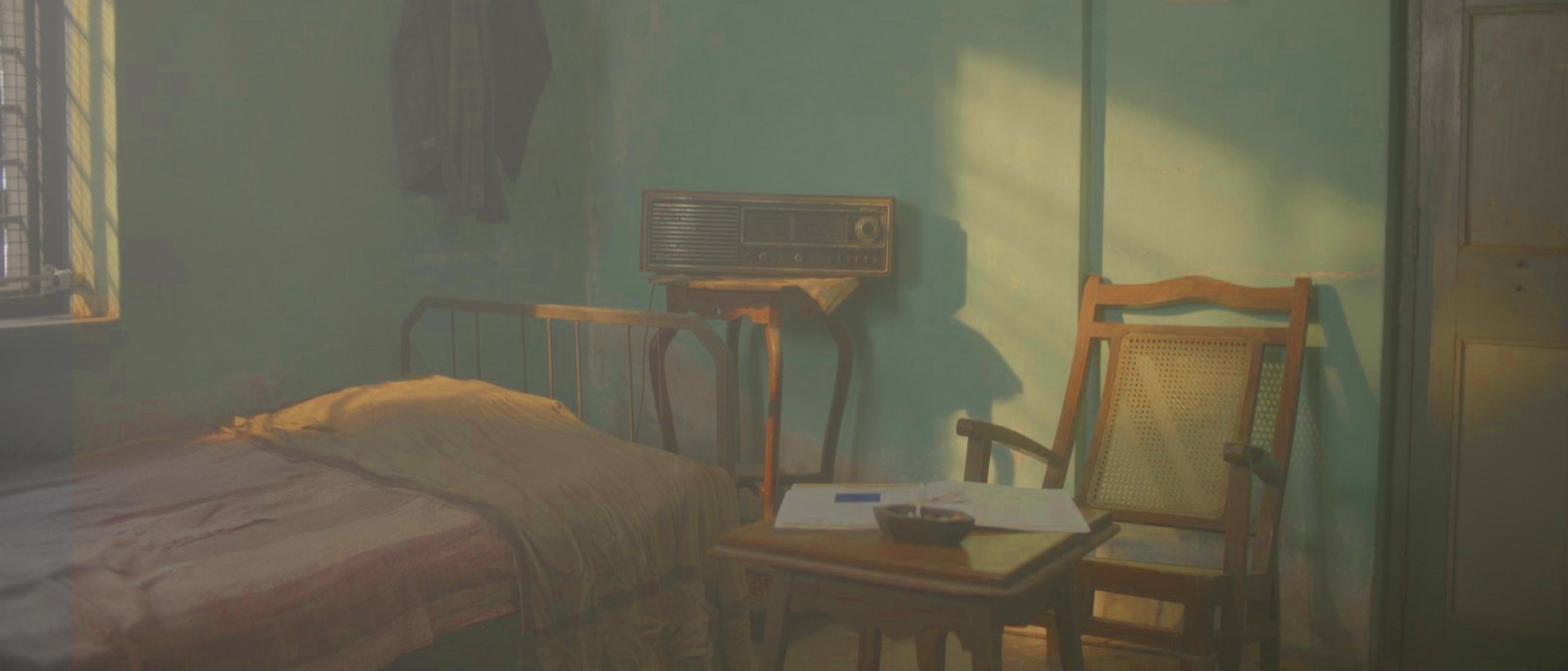 Empty bedroom set, still from Another Short Film About Killing