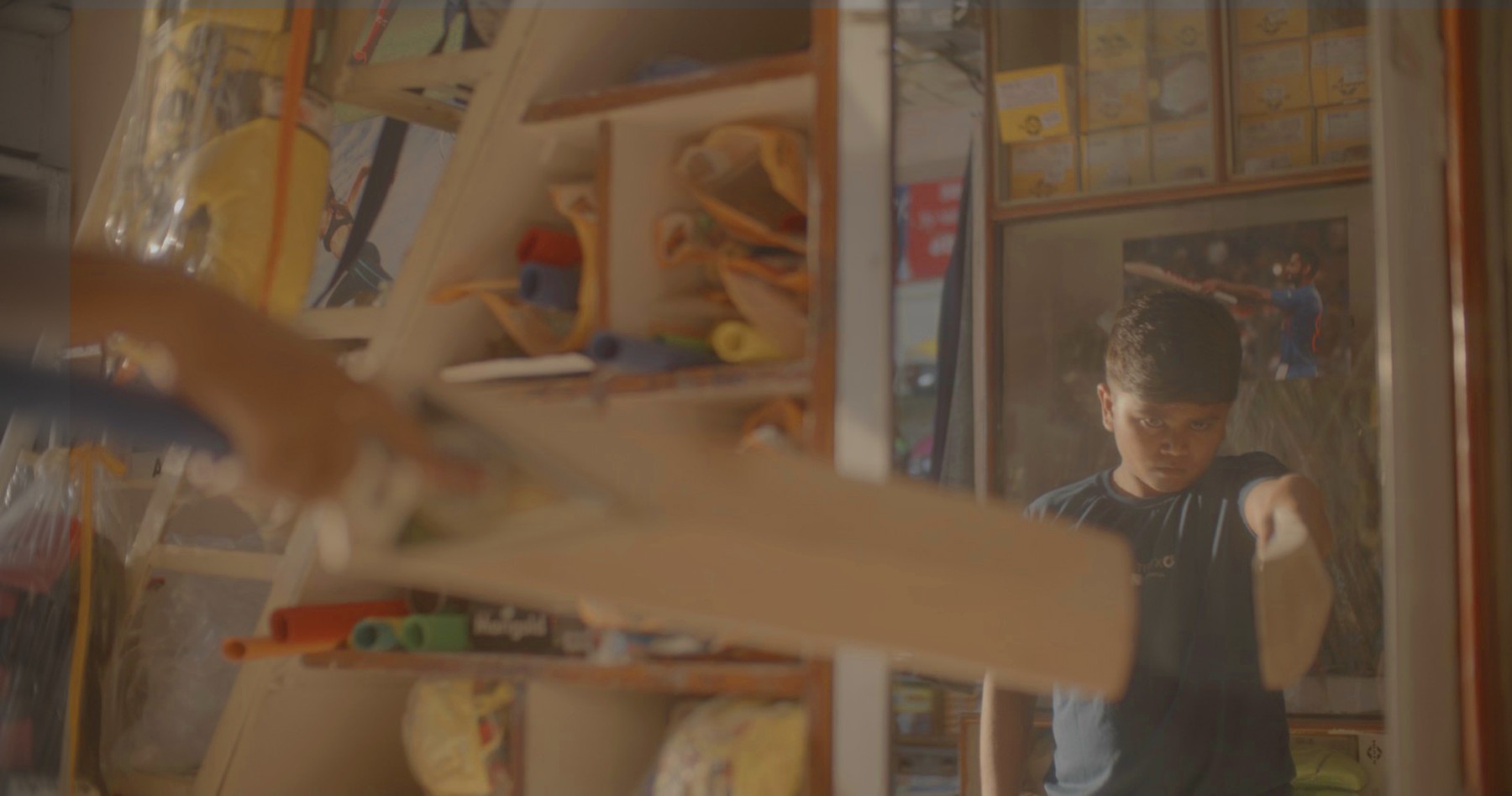 Boy with a cricket bat, still from Another Short Film About Killing