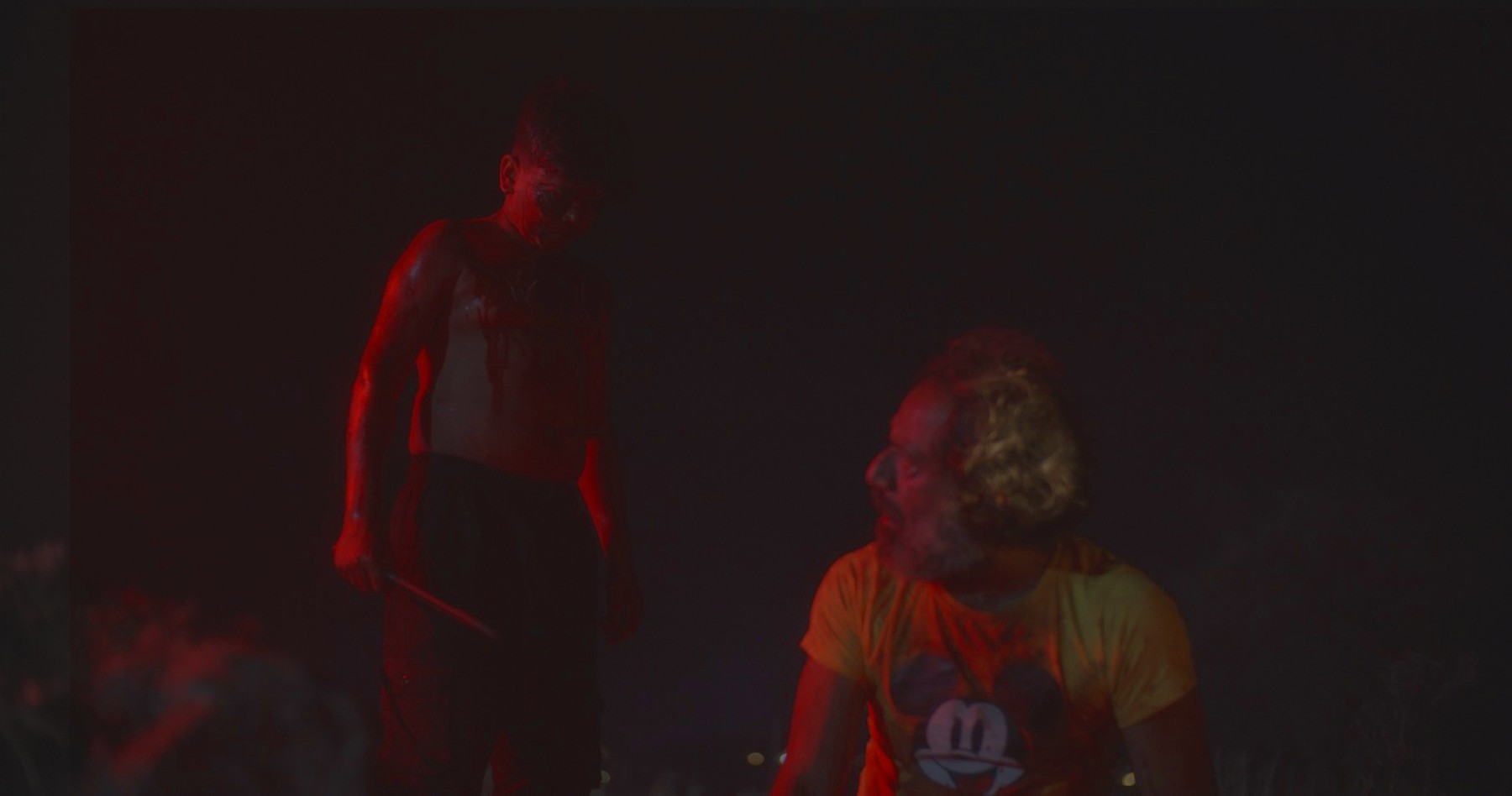 Red-lit night scene, still from Another Short Film About Killing