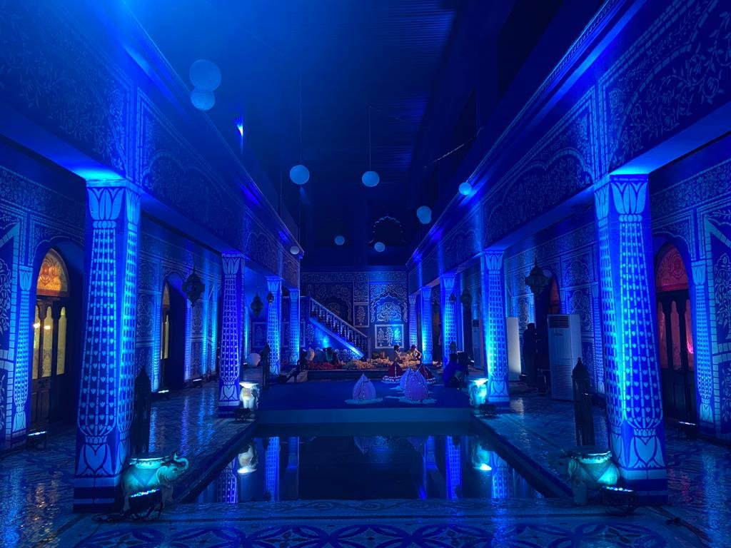 Blue lit palace hallway installation