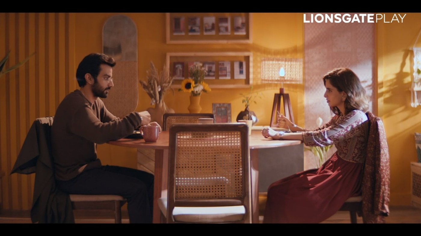 Film still, dining table scene