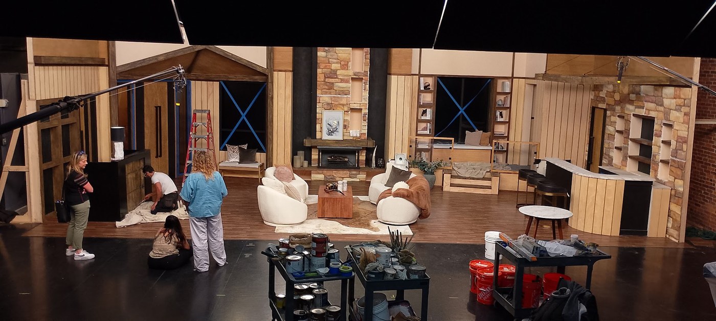 Crew painting and dressing the set