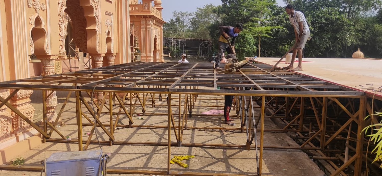 Crew building the structure by day