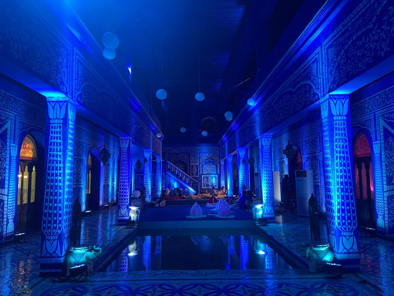 Blue-lit hallway, completed event design