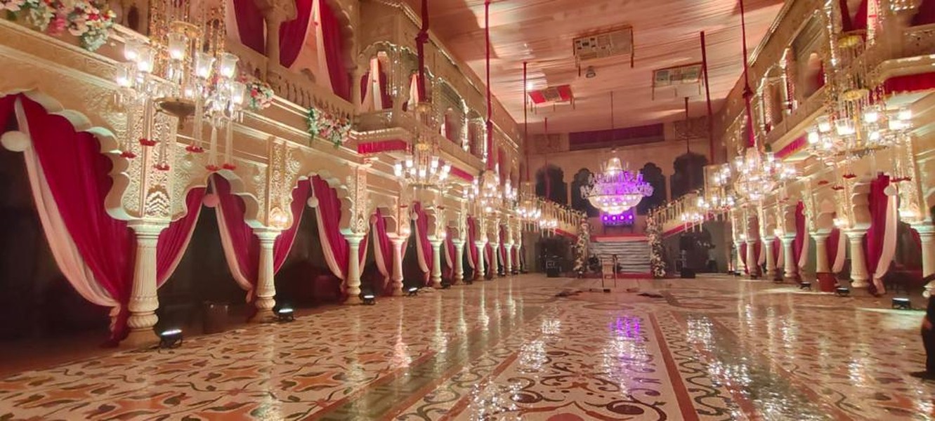 Gold-lit hall with chandeliers