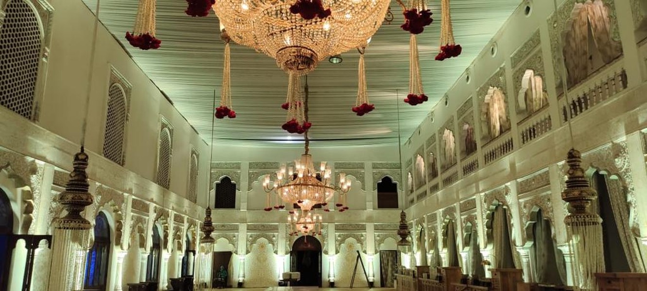 Cream hall with chandelier and floral drops