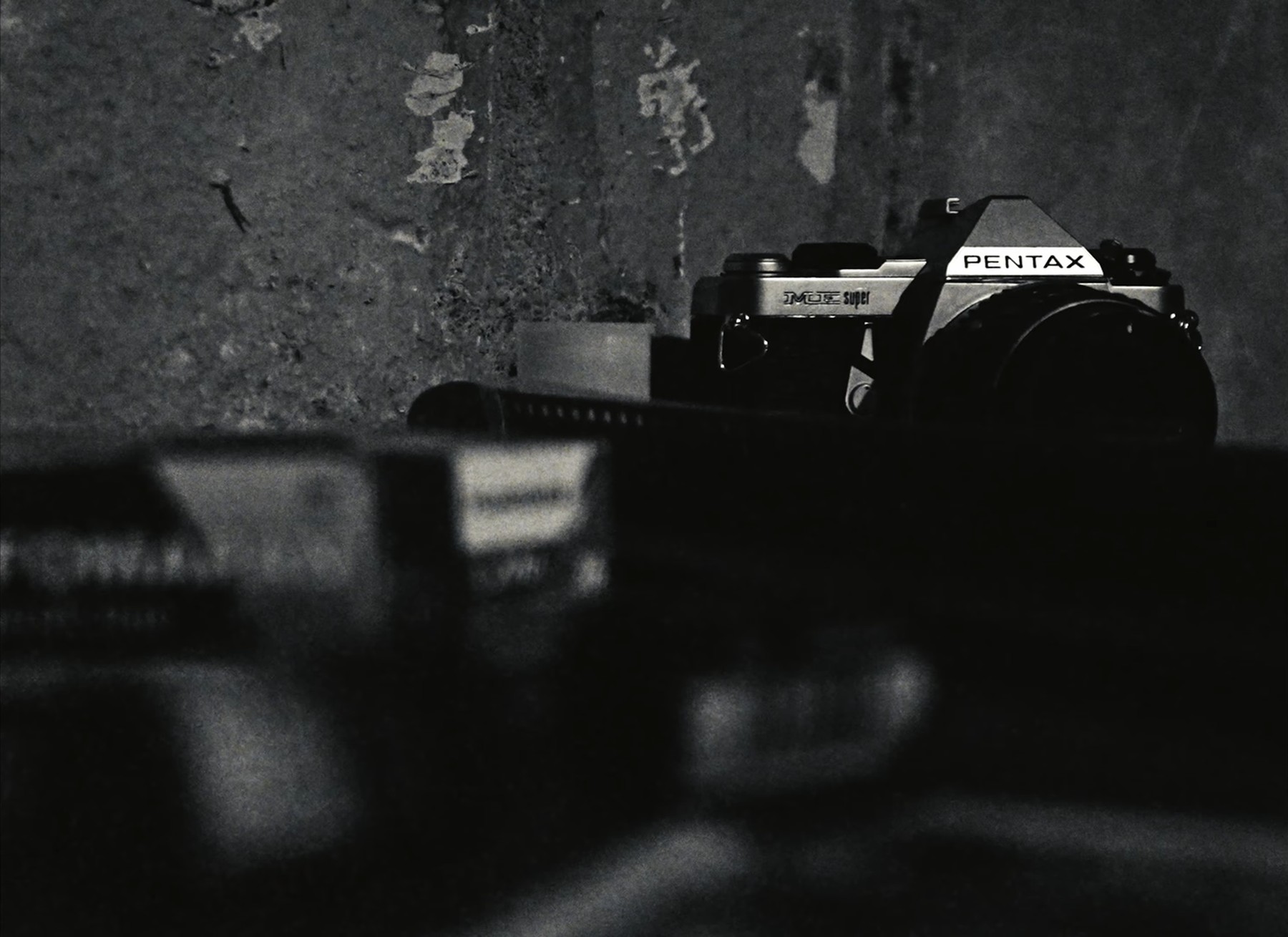 Close-up of a vintage Pentax camera, still from Paychecks