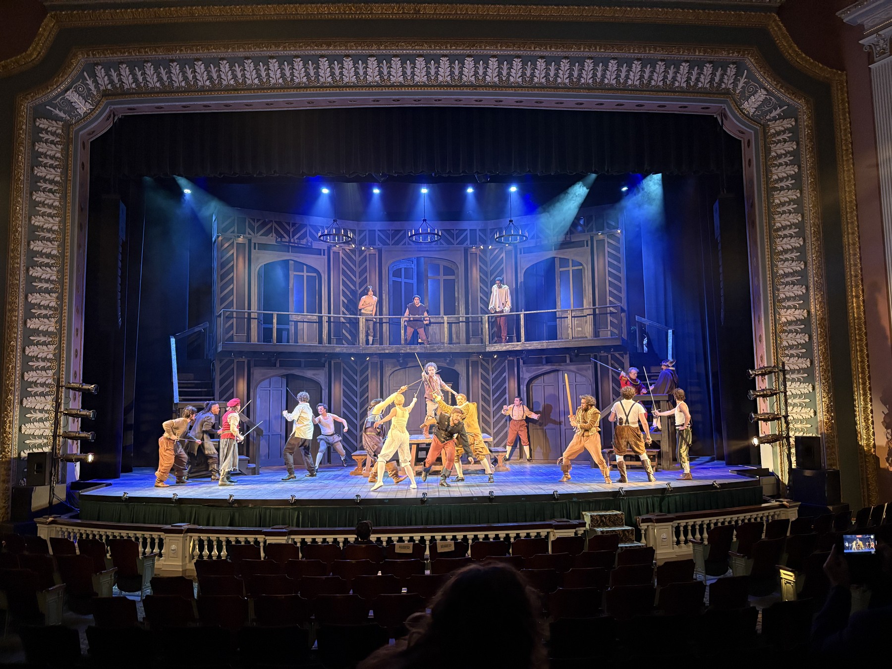 Full ensemble sword-fighting scene on stage, Shakespeare in Love