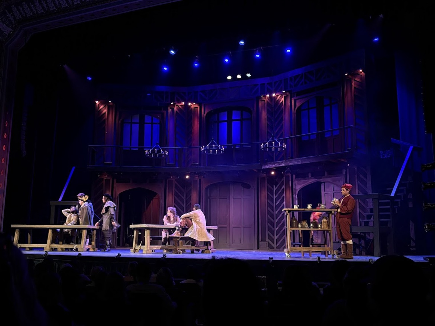 Tavern scene with actors around wooden tables, Shakespeare in Love